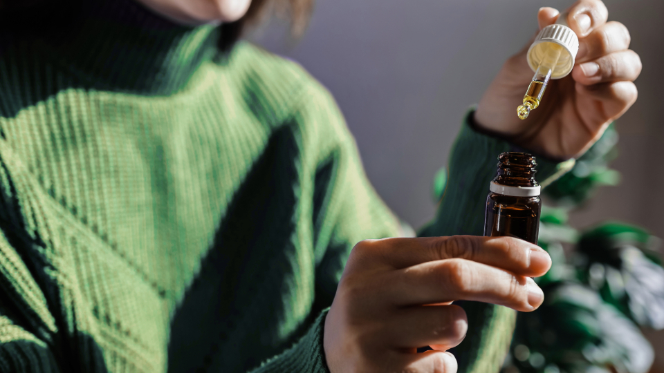 Woman opening tincture
