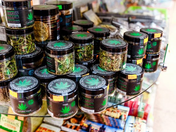 07 December 2017, Prague, Czech Republic: Sale of cannabis and other herbs in jars as a souvenir in the store